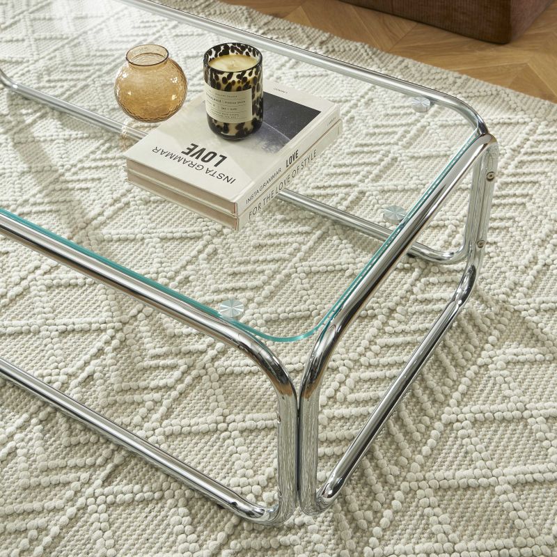Table basse MAGGY verre trempé transparent et structure en chrome